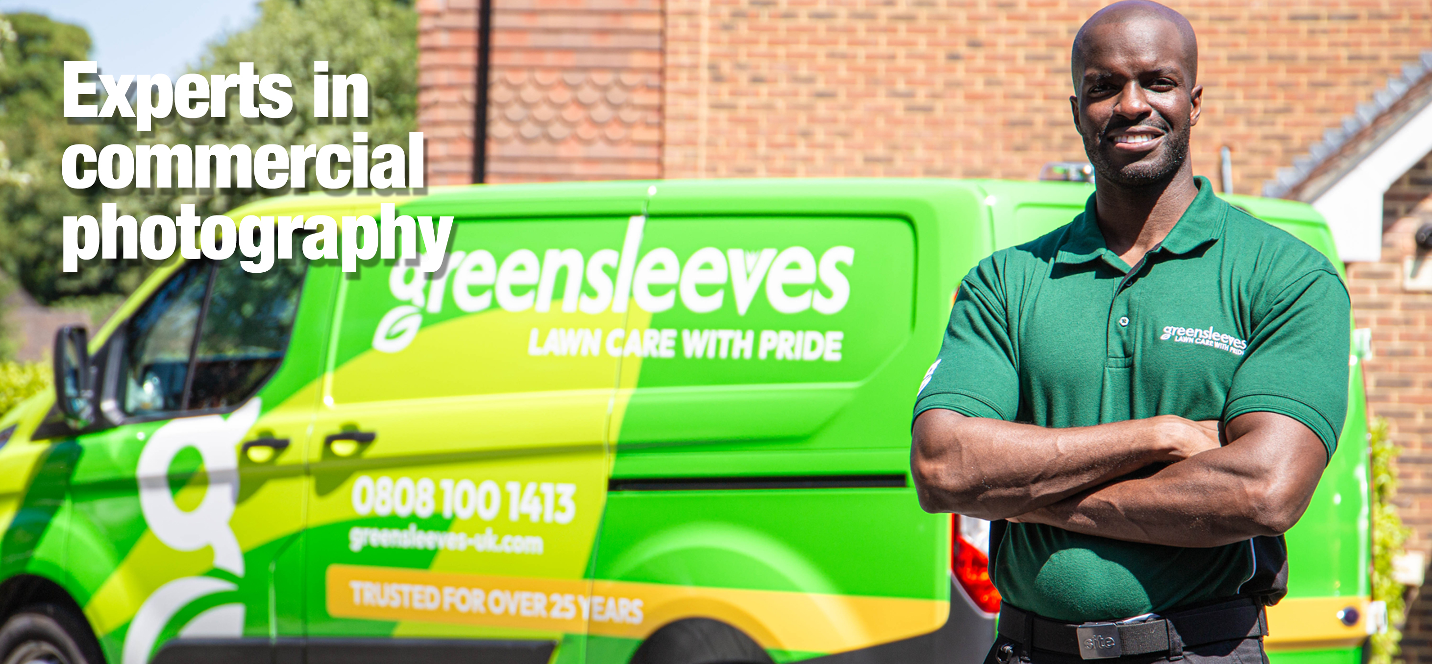 A Greensleeves employee stood in front of a branded van